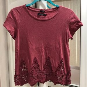 pink t shirt with lace-like trim